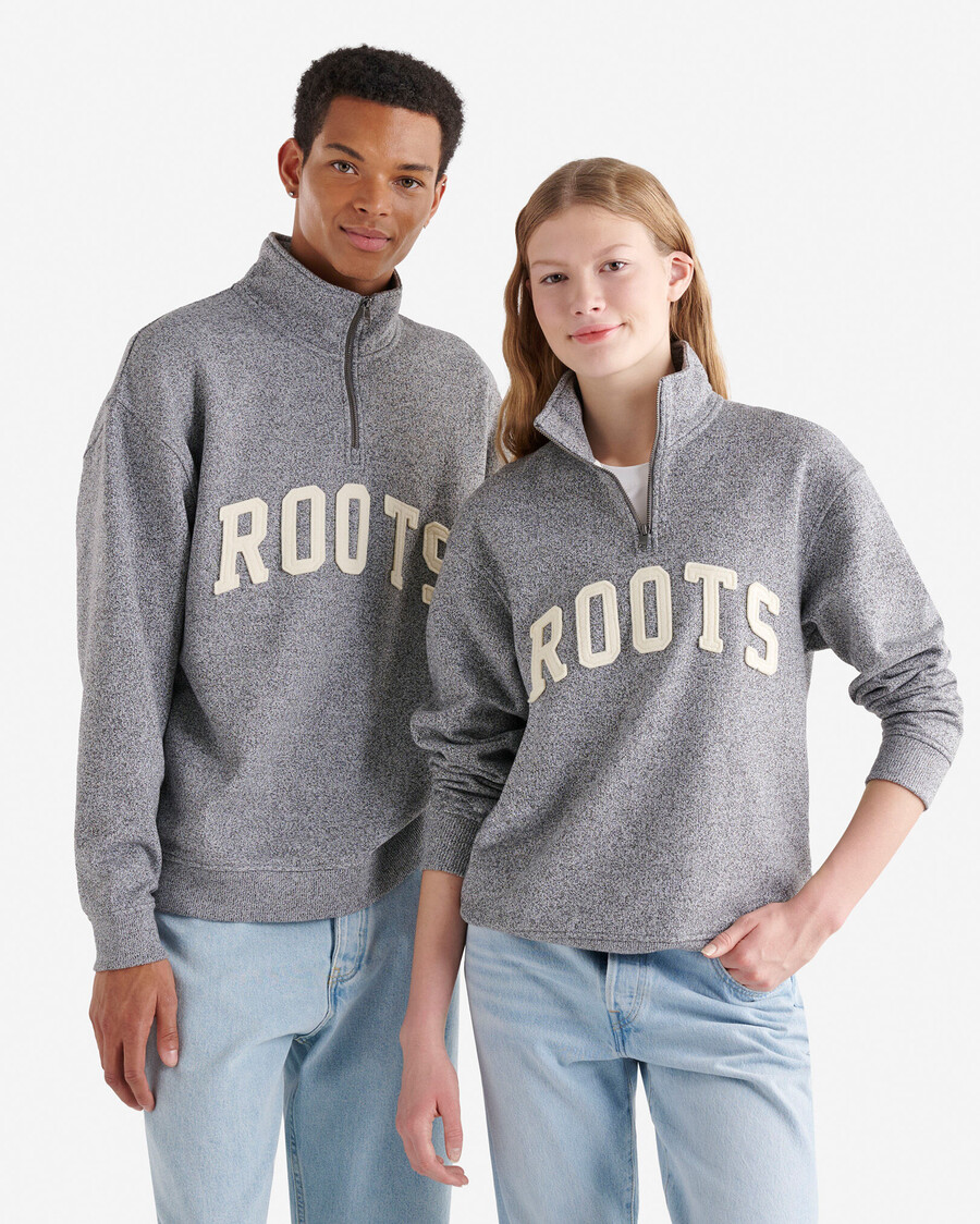 jarra de media cremallera con apliques roots