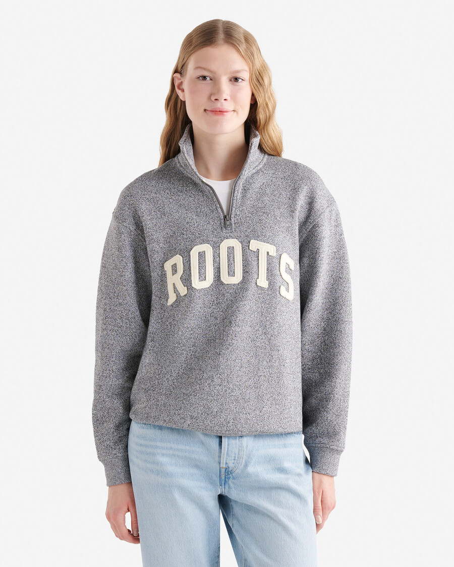 jarra de media cremallera con apliques roots